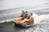HO Sports HG 3-Person Multi-Directional Ride-On Chariot and Couch Style Towable Tube with Attachments